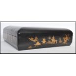 A late 19th century Chinese black lacquered and gilt games box with a detachable lid, enclosing five