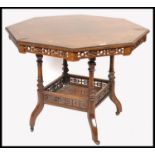 An Edwardian rosewood and marquetry inlaid octagonal centre table in the manner of Edwards &