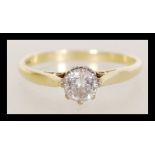 A hallmarked 18ct gold and diamond single stone solitaire ring having a central brilliant cut