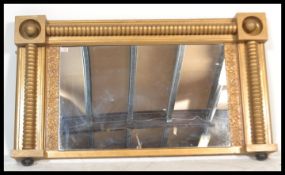 A 19th Century Victorian overmantel mirror frame having gilt bobbin columns with scrolled