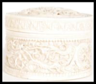A 19th Century Chinese carved ivory lidded pot of circular form having dragon decoration with