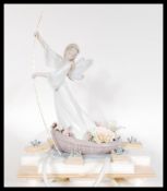 A Lladro model The Enchanted Lake 7679, limited edition 1999, 32 cm high (excluding top of pole),