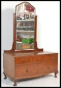 An early 20th Century circa 1930's mahogany low dressing chest of drawers, three short drawers