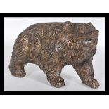 A good quality 20th century bronze figurine of a bear in the Black Forest taste having detailed