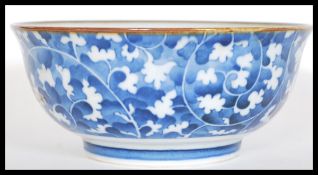 An early 20th Century Chinese blue and white ceramic bowl having hand painted decoration depicting