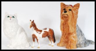 A collection of Beswick ceramics to include a fireside Yorkshire Terrier Model No 2377, a Pinto Pony
