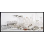 A selection of vintage scientific equipment to include petri dish stands, clamps, glass bottles