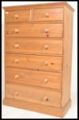 An antique style country pine two over five chest of drawers. The bank of drawers raised on plinth