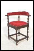 An early 20th Century Edwardian oak barley twist bedroom corner chair having an ebonised finish with
