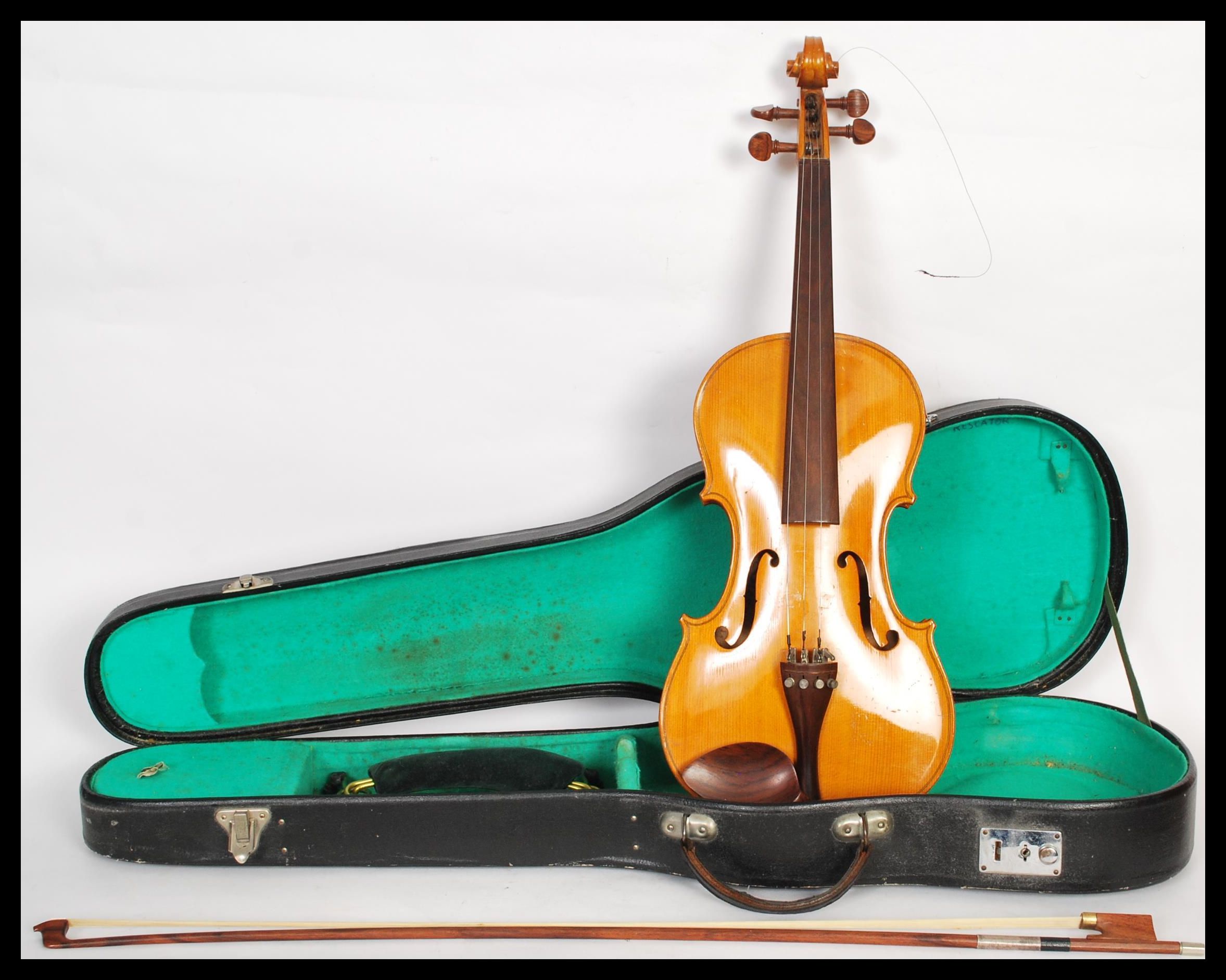 A student's 20th Century violin having an applied paper makers label to the interior marked