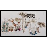 A selection of silver jewellery to include silver earrings with blue stones, a silver necklace