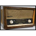 A vintage mid 20th Century Grundig model 3028 valve radio having glass facia to front.