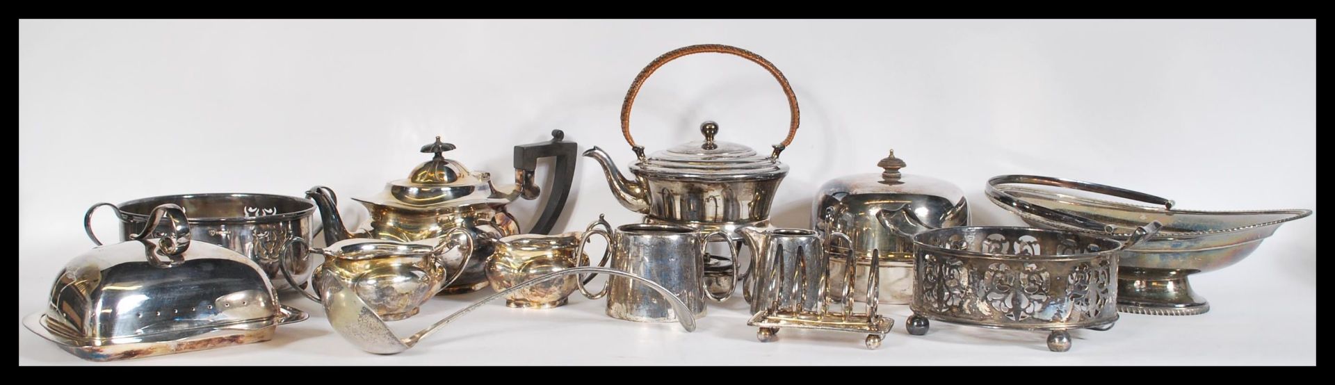 A collection of vintage early 20th Century silver plated items, to include a spirit kettle, toast