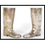 A pair of 20th Century silver plated drinks measures in the form of riding boots having raised