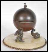 A 19th Century Victorian brass and alabaster inkwell raised on circular base with twist border.