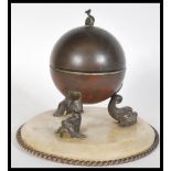 A 19th Century Victorian brass and alabaster inkwell raised on circular base with twist border.