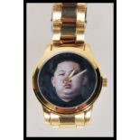 An unusual North Korean Kim Jong Un inspired wrist watch having a pictorial face in fitted
