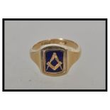 A hallmarked 9ct gold signet ring having a rectangular head with a rotating centre one side