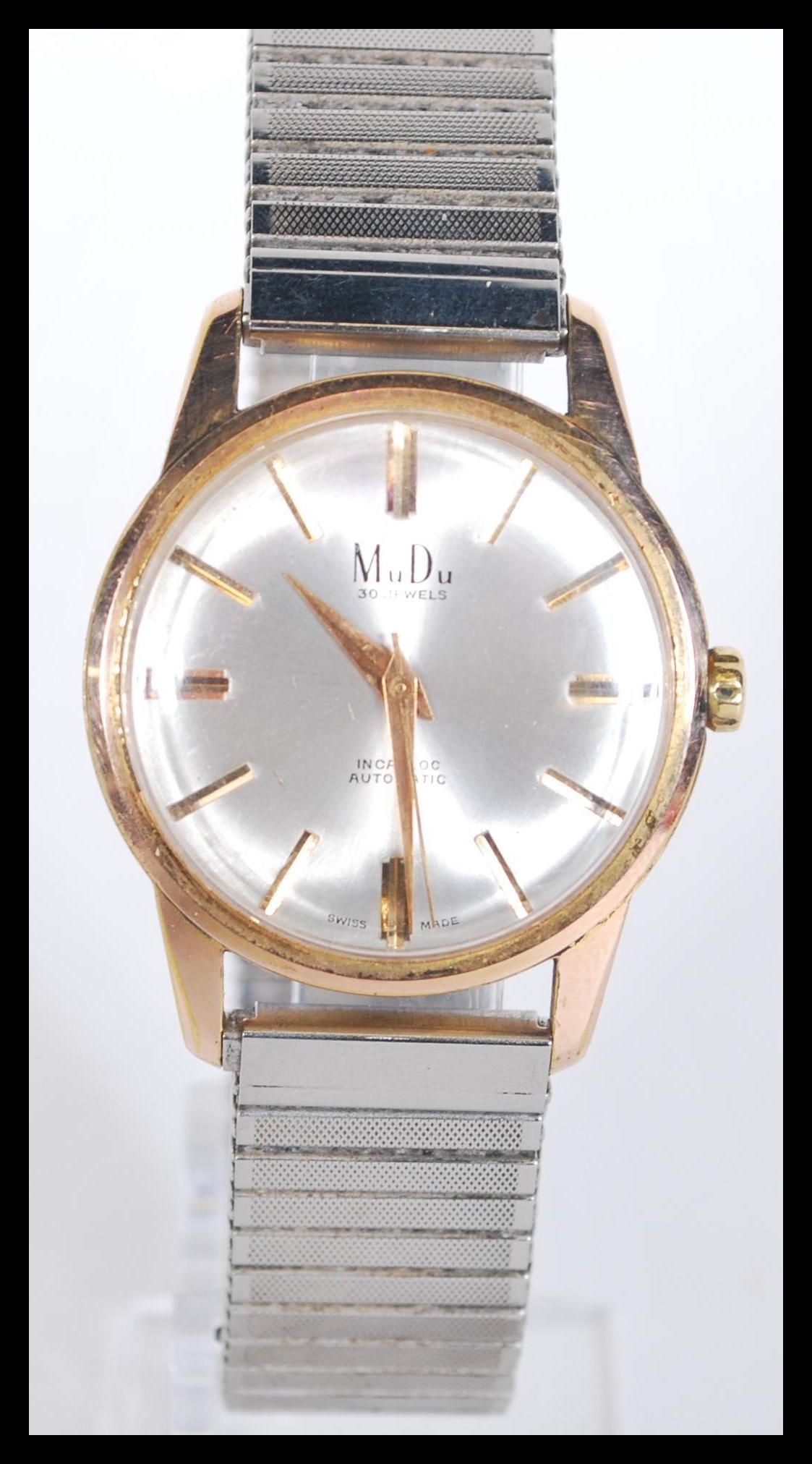A vintage mid 20th century gents MuDo automatic wristwatch having a silvered dial with gilt baton