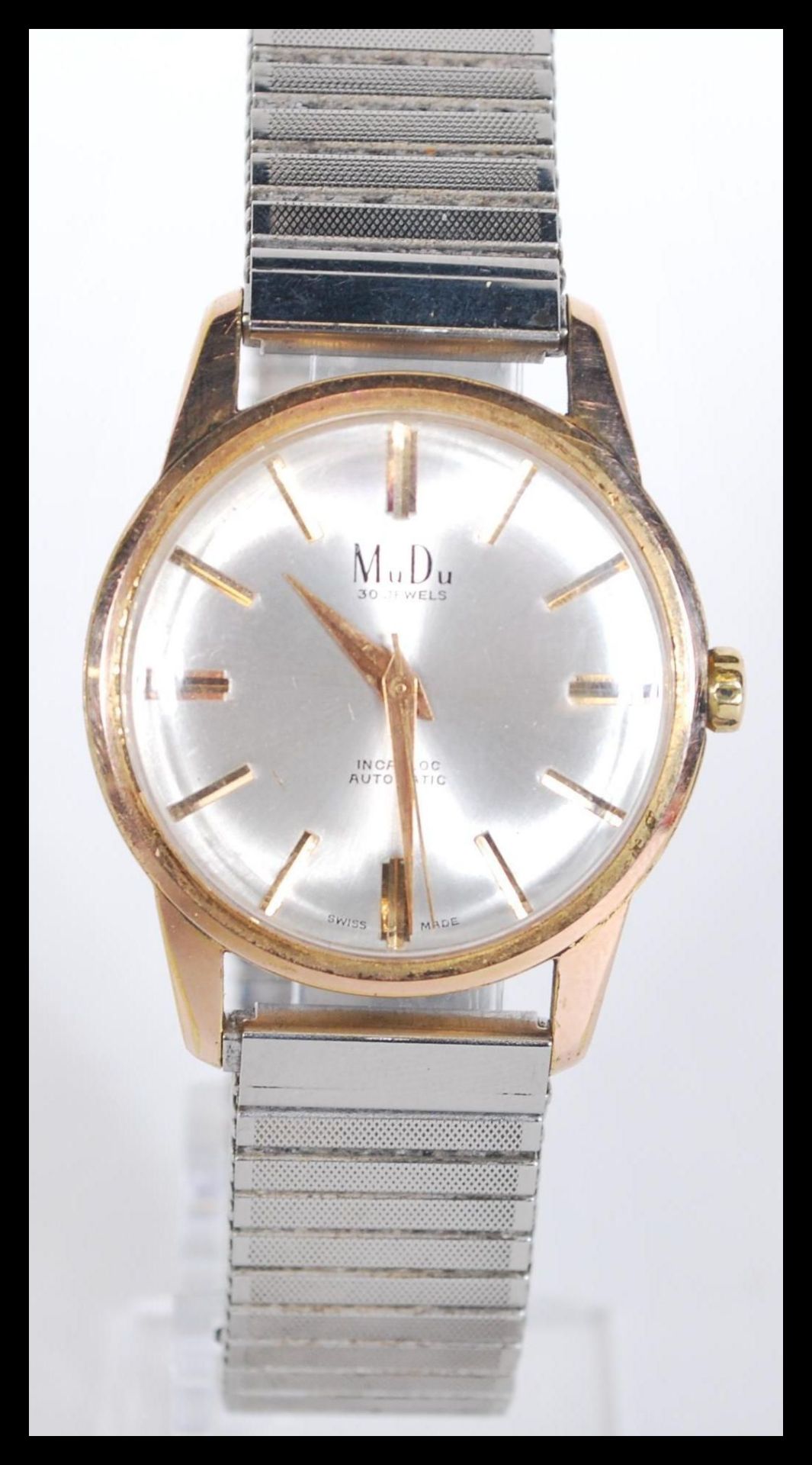 A vintage mid 20th century gents MuDo automatic wristwatch having a silvered dial with gilt baton