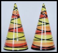 A pair of  Crown Devon sugar shakers in the style of Clarice Cliff hand painted by Dorothy Ann in