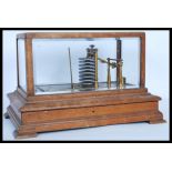 A late 19th Century Victorian barograph, oak-cased with bevelled glass panes, retailer Callaghan &