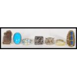 A collection of unusual oversized dress costume rings to include Art Deco style blue stone, large