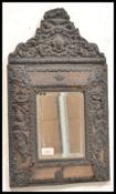 A 19th Century French Repose cushion mirror having a central bevelled glass panel with brass