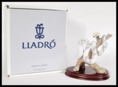 A Lladro Zodiac collection ceramic figurine entitled The Snake 6780. The Lladro figure modelled as a
