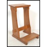 A 20th Century oak ecclesiastical prie-Dieu / lectern in the Arts and Craft manner, with sloped