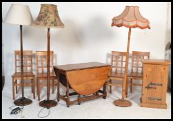 A collection of vintage furniture to include a set of four pine dining chairs with cross board