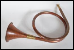 Hunting interest -A vintage early 20th Century copper and brass single coil  hunting horn / bugle of