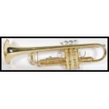 A vintage brass trumpet musical instrument complete in fitted case by SMS Academy. Measures 49cm