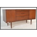 A retro 20th Century Danish inspired teak sideboard - credenza of small proportions, having a