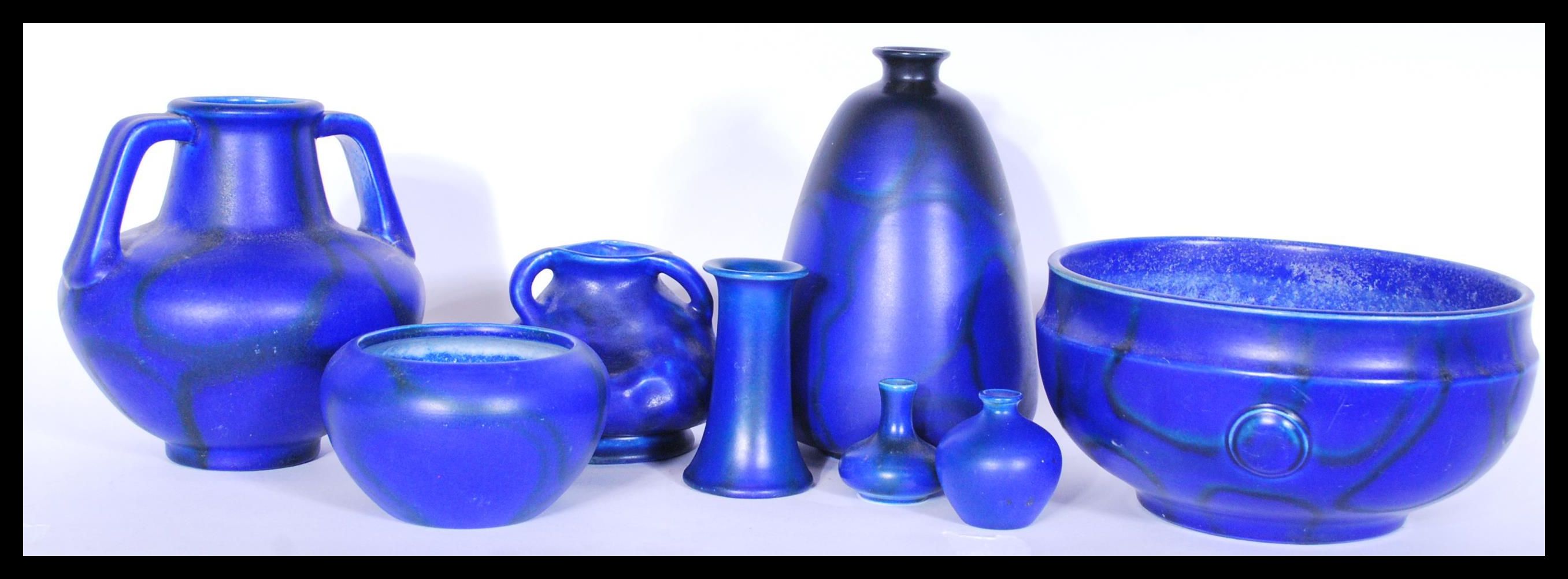 A collection of Bretby 19th / early 20th Century pattern ceramics having blue mottled drip glaze