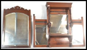 A 19th Victorian mahogany overmantel mirror having turned columns with large urn decoration and