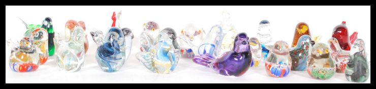 A collection of approx 25 studio art glass paperweights in the form of birds to include Murano,