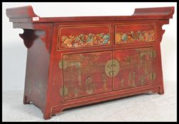 A Chinese red lacquer sideboard altar having painted and gilded decoration depicting court scenes