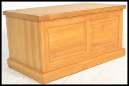 An antique style country pine blanket box coffer chest having hinged lid opening to reveal a