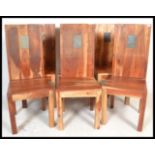 A set of six 20th Century Sheesham wood dining chairs of squat form having stone inlaid back