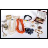 A group of vintage jewellery to include silver thistle necklace, watch, coral necklace, turtle