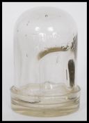 An early 20th Century Edwardian glass chicken waterer consisting of a glass dome marked ' Thomas's