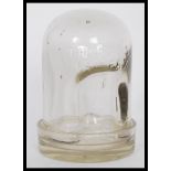 An early 20th Century Edwardian glass chicken waterer consisting of a glass dome marked ' Thomas's