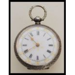 An early 20th Century continental silver fob pocket watch having engraved foliate decoration to