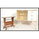 A vintage retro mid 20th Century formica sideboard side unit cabinet of small proportions raised