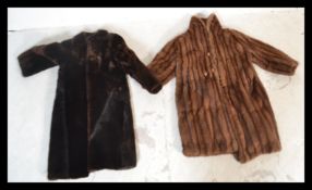 A vintage early 20th Century full length ladies fur coat together with a simulated fur full length