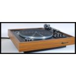 A vintage retro 20th Century teak cased record player having a Garrard 86SB turntable deck with