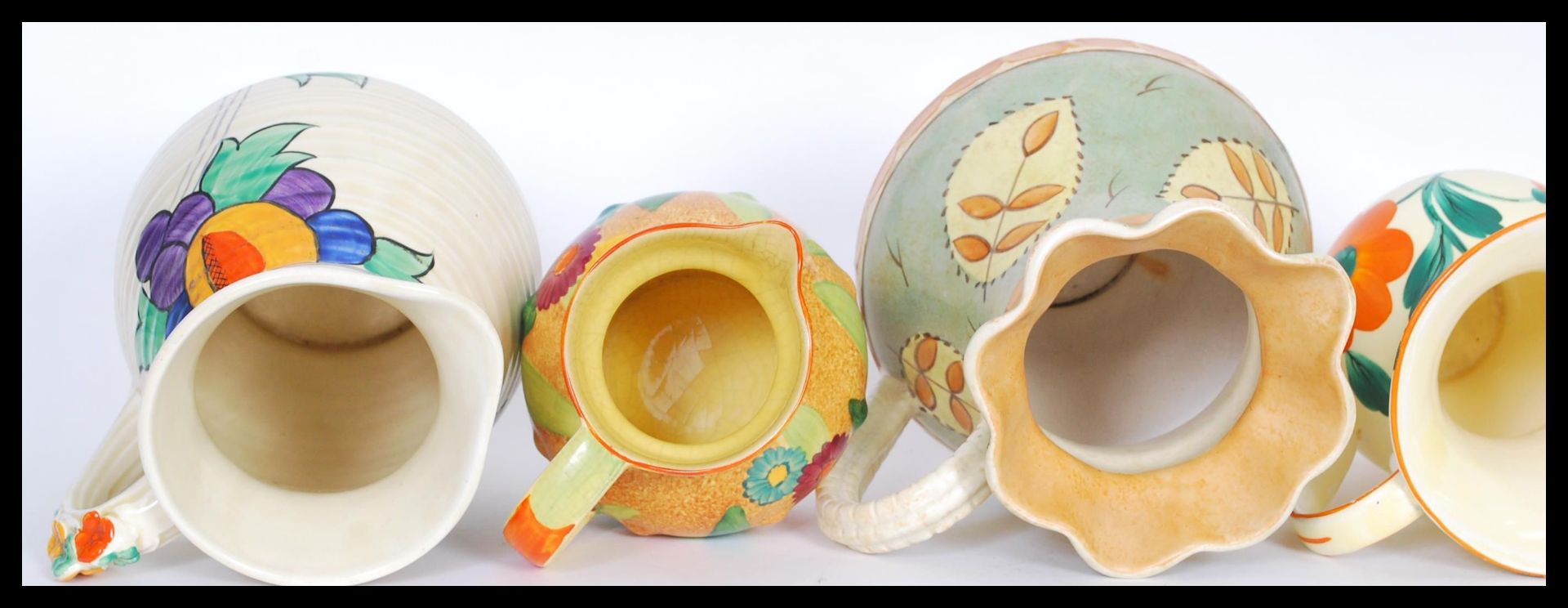 A selection of mid 20th Century hand painted ceramic jugs to include a burleigh ware jug having a - Bild 3 aus 6