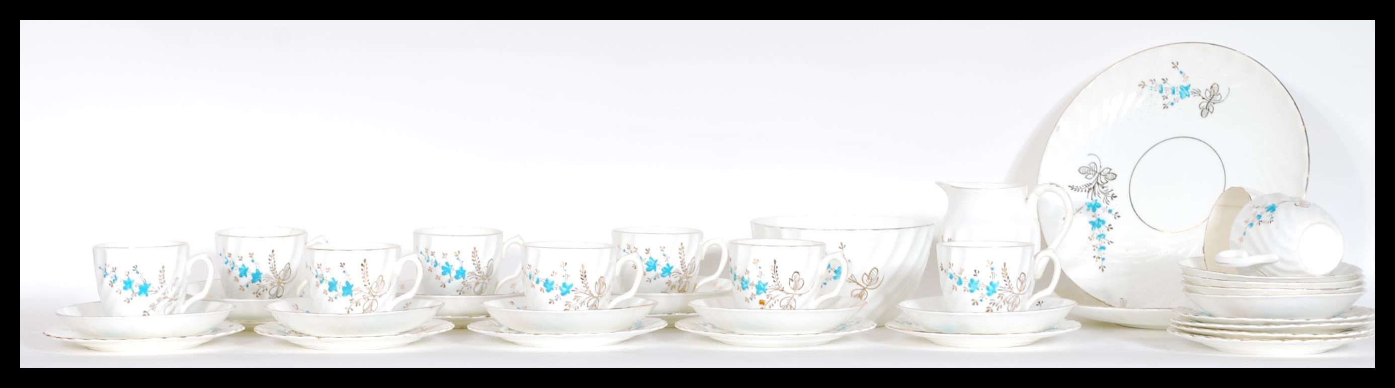 An early 20th Century ten person fine English bone china tea service consisting of ten fluted cup