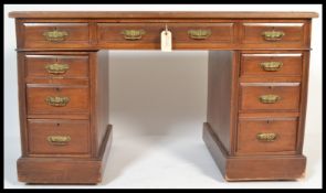 A 19th Century Victorian mahogany twin pedestal desk by H.Mawer & Stephenson, having an
